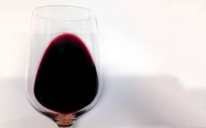 Tilt the glass around 45° against a white surface